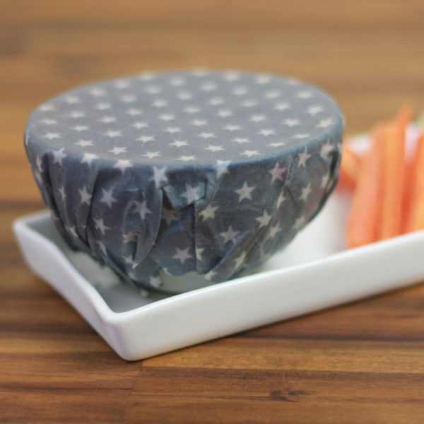 Small grey beeswax wrap covering bowl