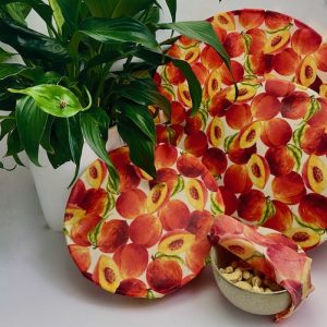 Organic peach fabric beeswax wraps covering bowls